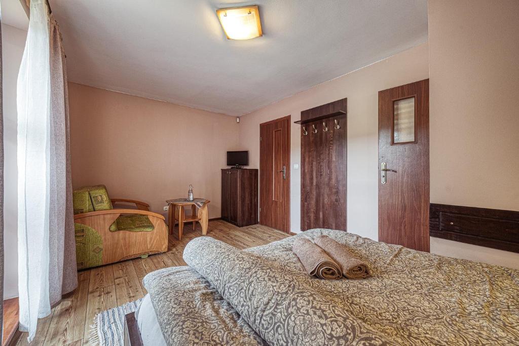 Postel nebo postele na pokoji v ubytování ZET - Penzion & Wellness