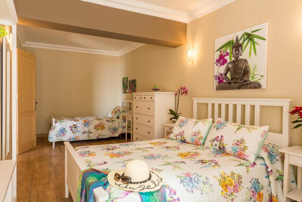 Postel nebo postele na pokoji v ubytování Casa Quintana - Apartamento Ángela