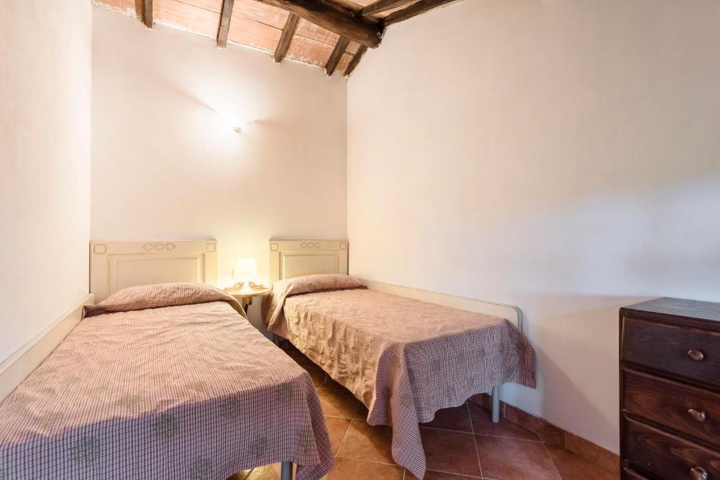 Postel nebo postele na pokoji v ubytování Podere I Massoni