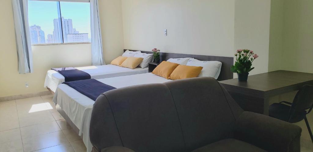 Postel nebo postele na pokoji v ubytování Infinity Hotel