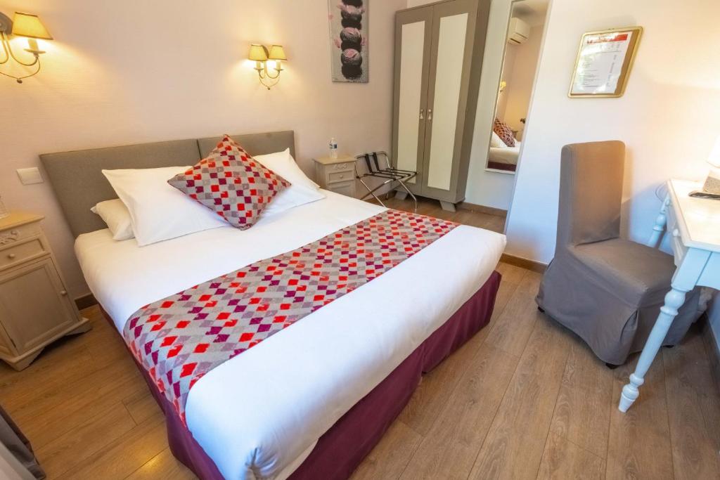 Postel nebo postele na pokoji v ubytování Hotel Sainte Anne - Apt