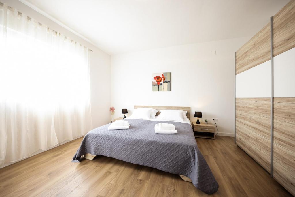 Postel nebo postele na pokoji v ubytování Villa Visum