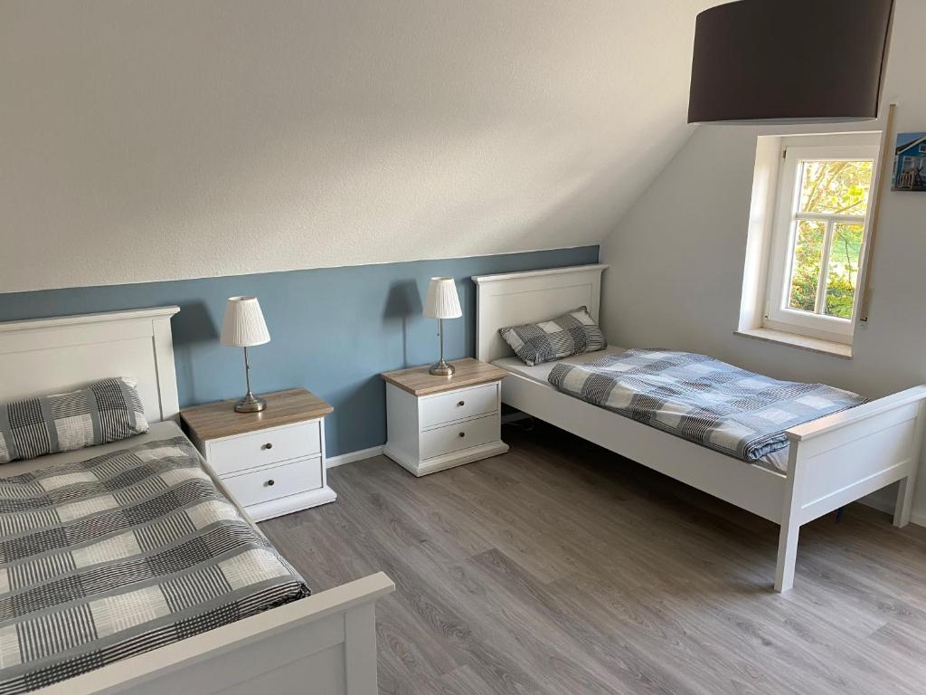Postel nebo postele na pokoji v ubytování Ferien-am-Uhlenmeer Keine-Monteure