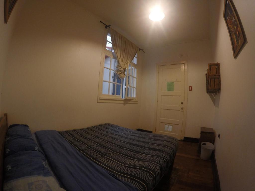 Postel nebo postele na pokoji v ubytování Lemuria Hostel