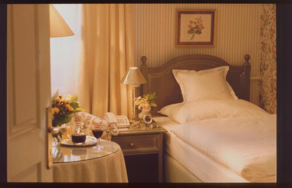 Postel nebo postele na pokoji v ubytování Unser kleines Hotel Café Göbel