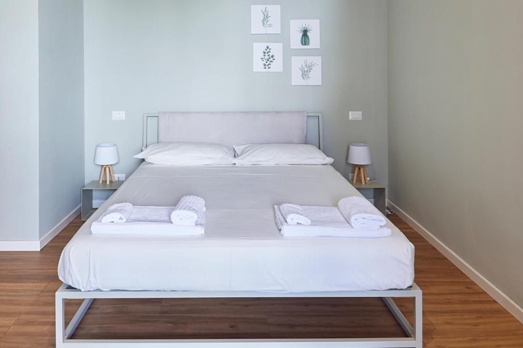 Postel nebo postele na pokoji v ubytování Lapilanoa - Suite & Pool