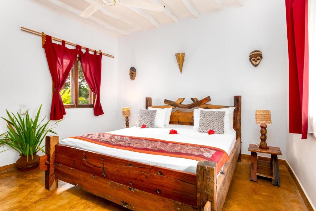 Postel nebo postele na pokoji v ubytování Kibanda Natural Kendwa Villa