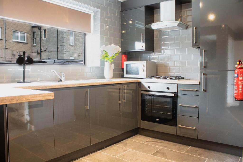 Kuchyň nebo kuchyňský kout v ubytování Forth Apartments