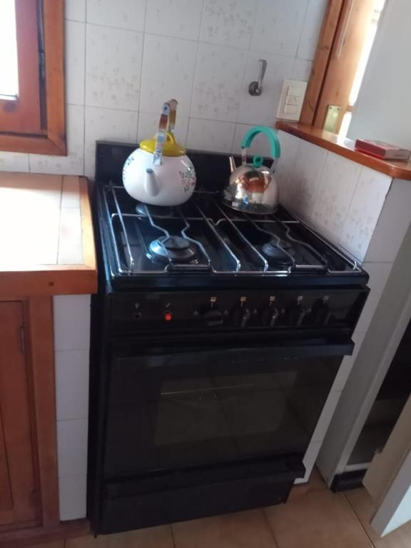 Kuchyň nebo kuchyňský kout v ubytování Cabaña en el Centro