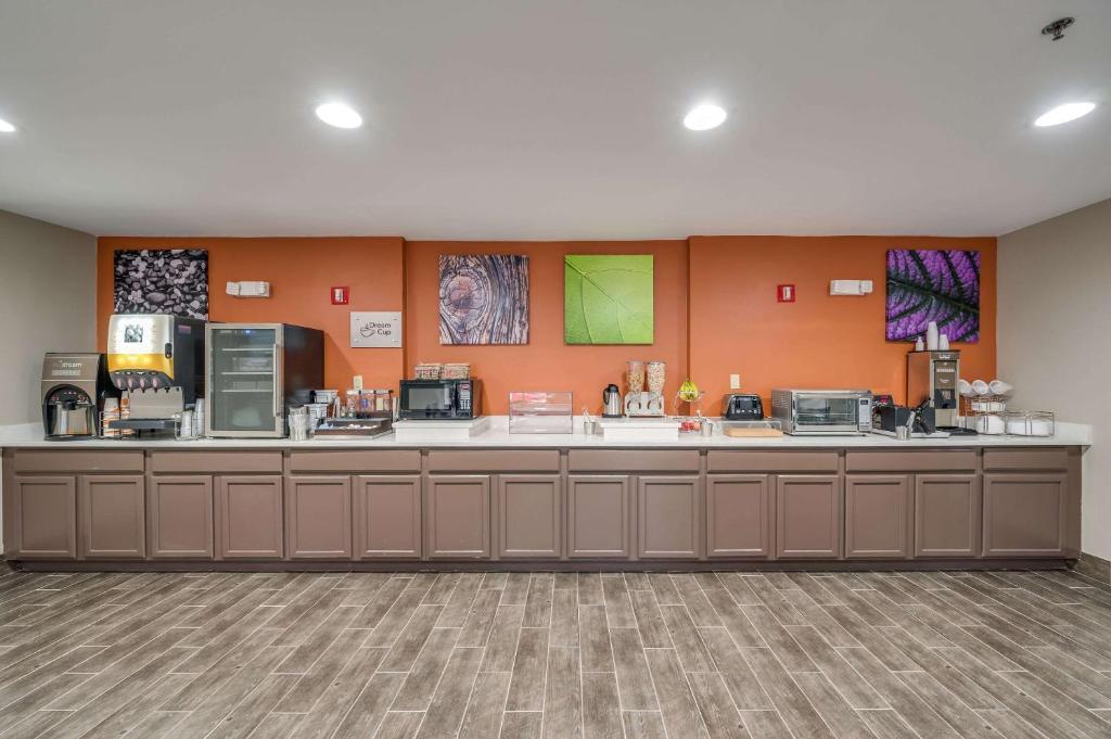a lobby of a hotel with a large counter at Sleep Inn & Suites in Decatur
