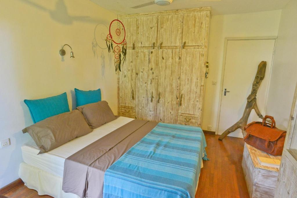 Postel nebo postele na pokoji v ubytování Tree Lodge Mauritius