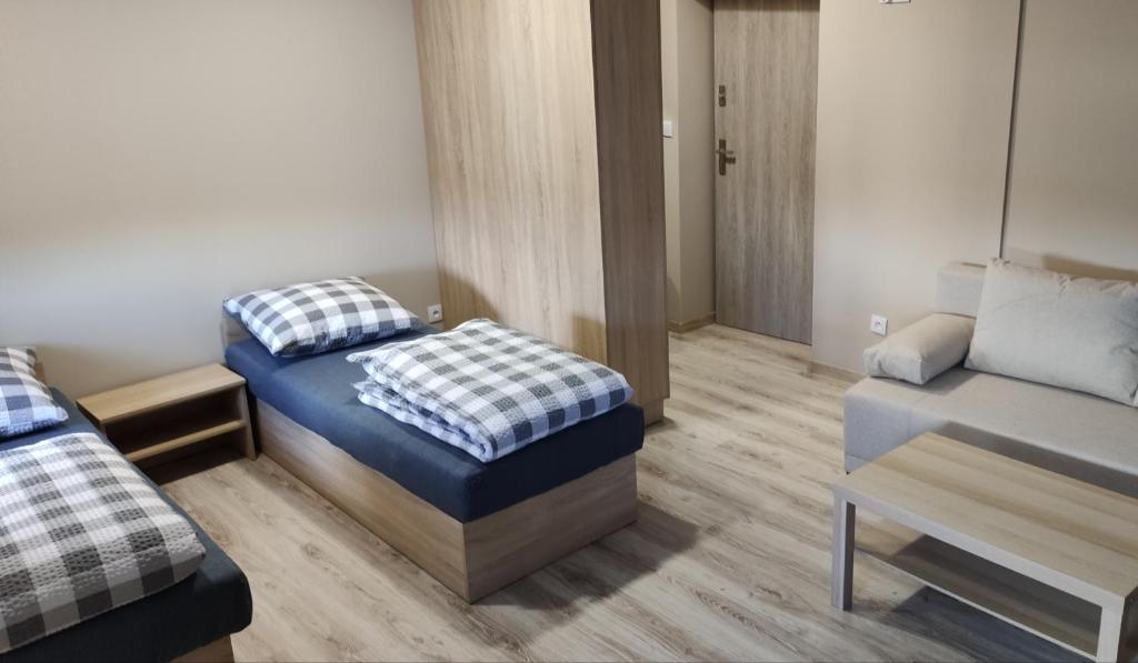 Posteľ alebo postele v izbe v ubytovaní Krollhouse Pokoje gościnne