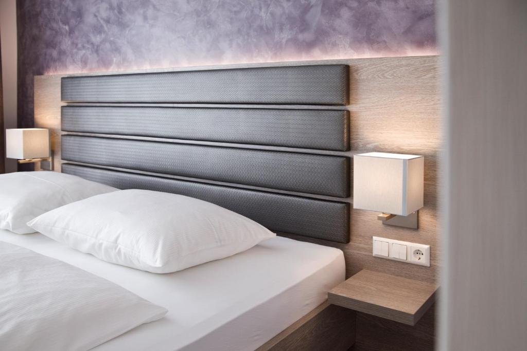 Postel nebo postele na pokoji v ubytování Hotel Rieth