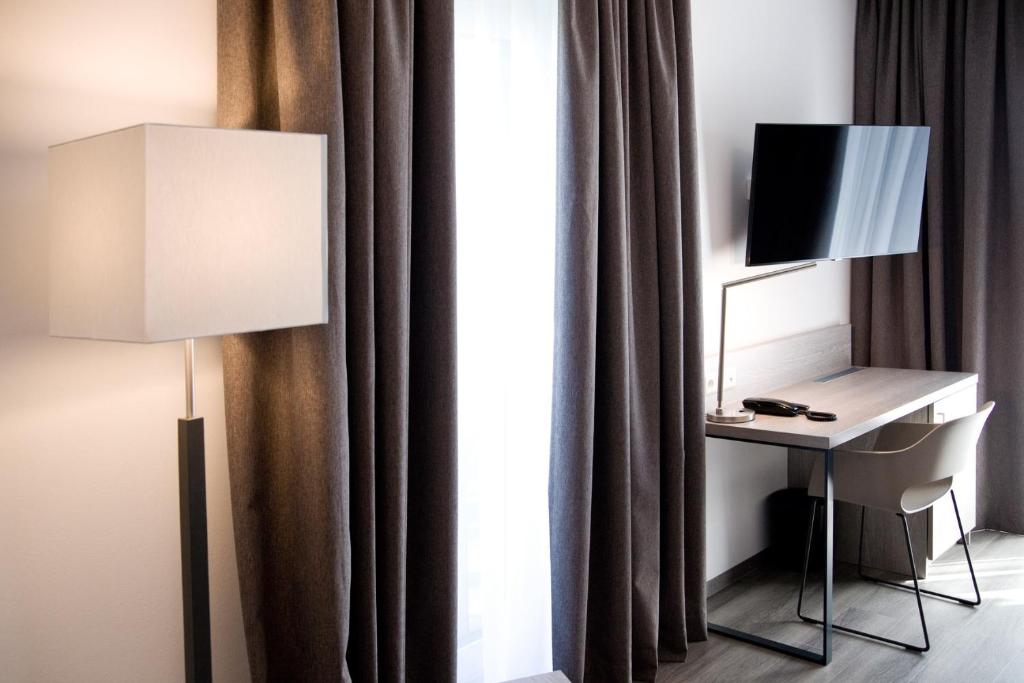 TV a/nebo společenská místnost v ubytování Hotel Rieth