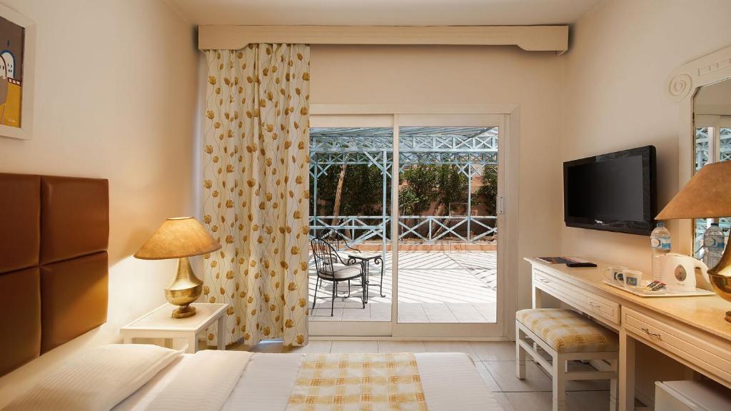 TV a/nebo společenská místnost v ubytování Giftun Azur Resort