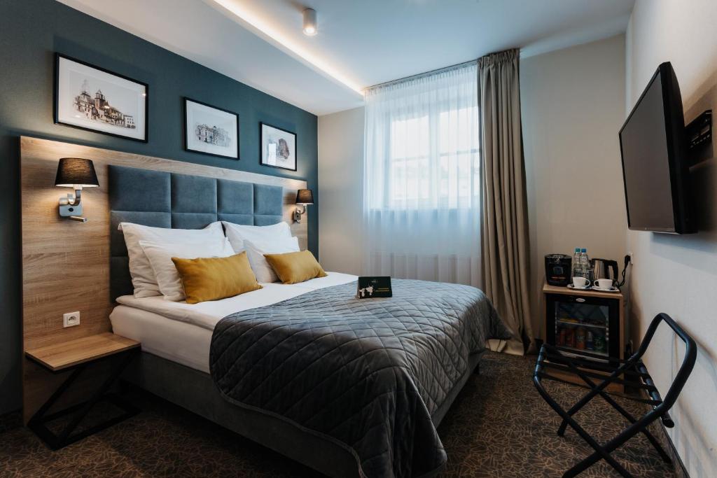 Posteľ alebo postele v izbe v ubytovaní Hotel 32 Kraków Old Town