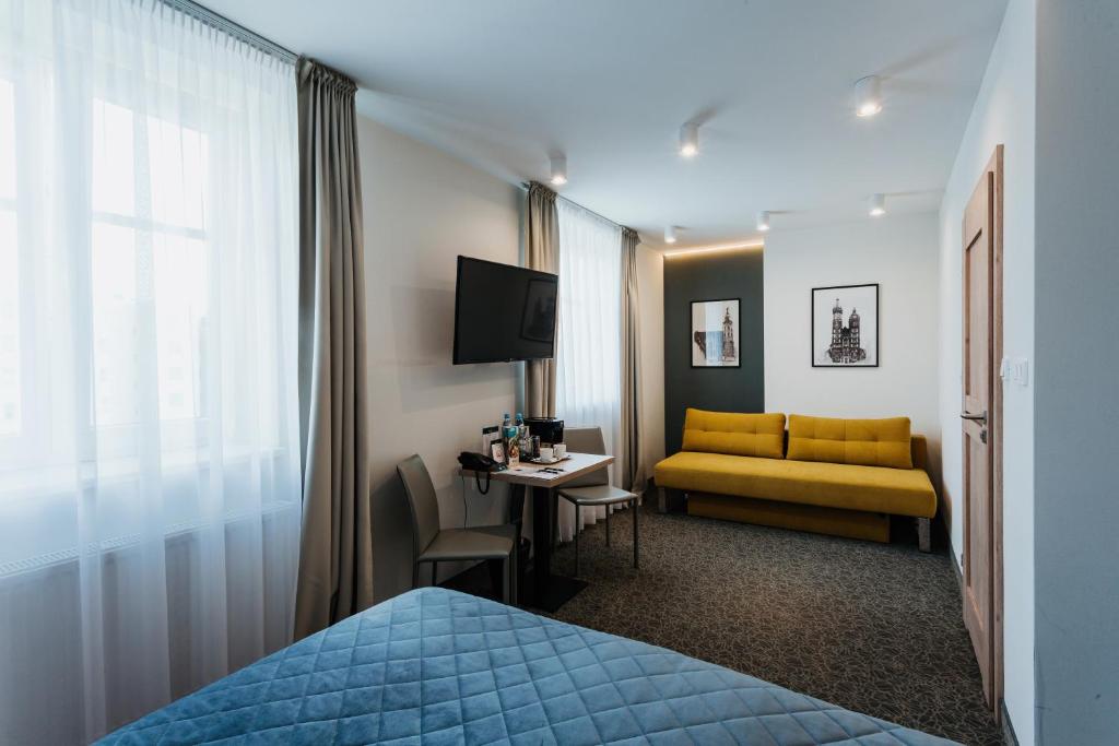 Posteľ alebo postele v izbe v ubytovaní Hotel 32 Kraków Old Town