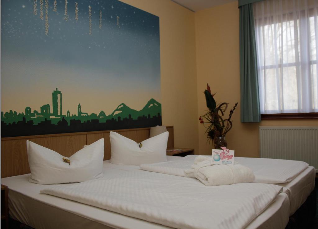 Voodi või voodid majutusasutuse Jembo Park Hotel toas