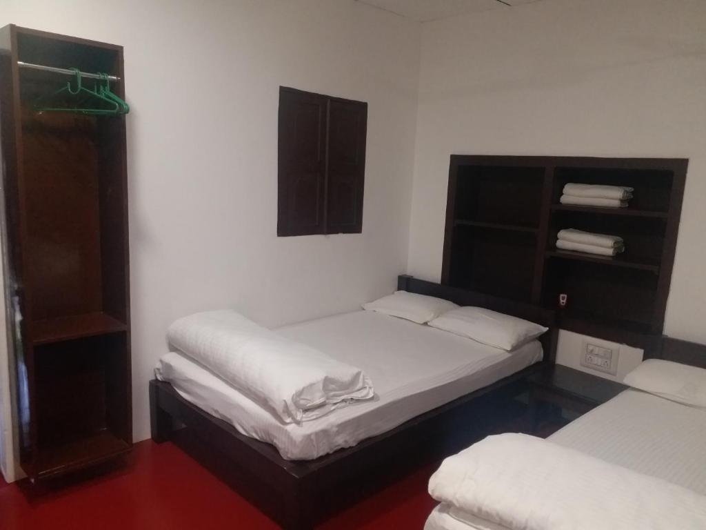 Postel nebo postele na pokoji v ubytování Back To Nest Homestay