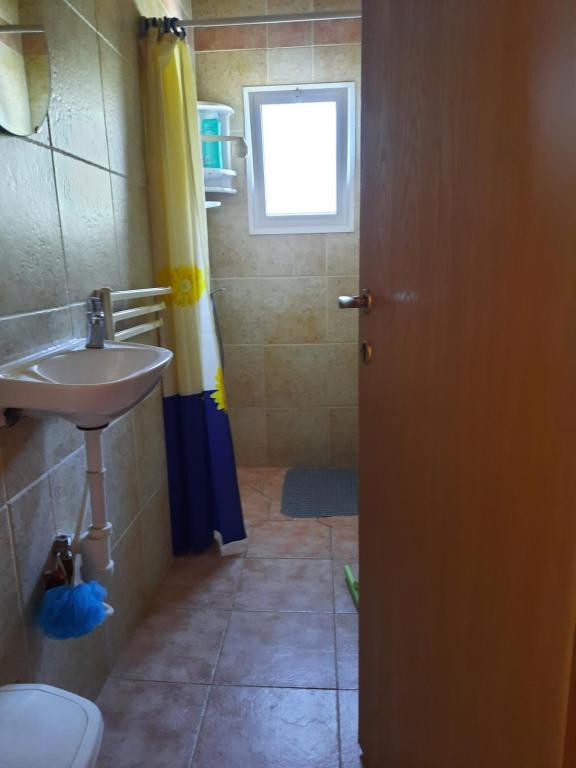Koupelna v ubytování Sapir Apartment
