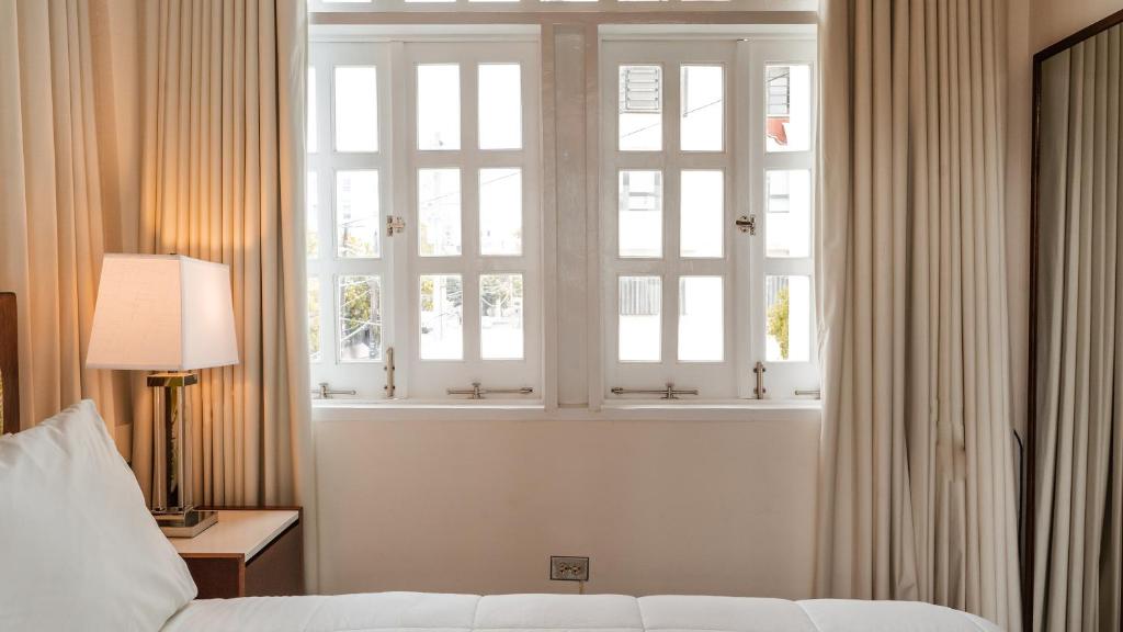 Postel nebo postele na pokoji v ubytování Casa Wilson Inn