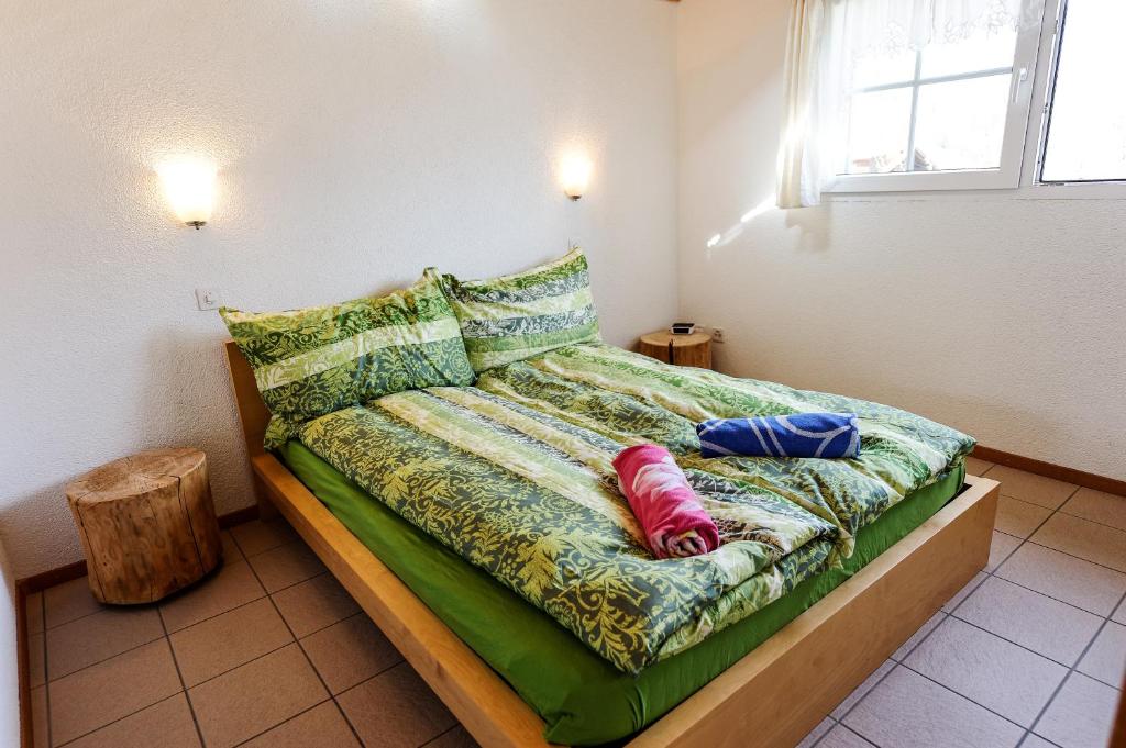 Postel nebo postele na pokoji v ubytování Swiss Holiday House