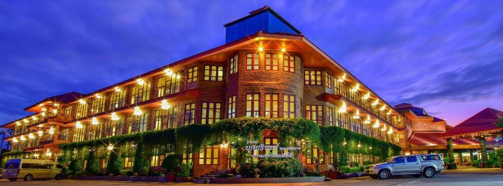 a large building with lights on it at night at Busyarin Hotel in Nong Khai