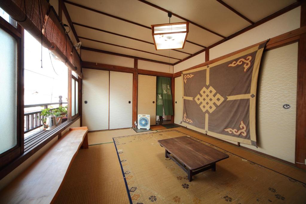 Fotografie z fotogalerie ubytování Buddha Guest House v destinaci Tanabe