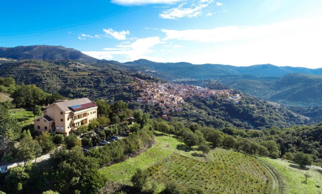 an aerial view of a house on a mountain at Hotel Miramonti Seulo Turismo Rurale in Seùlo