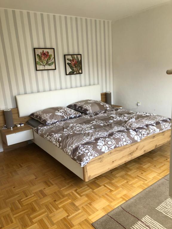 a bedroom with a bed in a room at Gästehaus Alm-Blick in Murrhardt