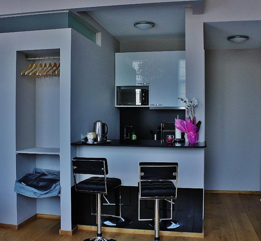 Kuchyň nebo kuchyňský kout v ubytování B&B Avenue Deschanel