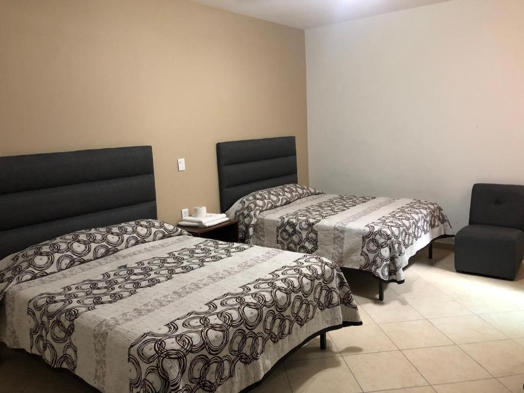 Postel nebo postele na pokoji v ubytování Hotel Posada Ruiseñor