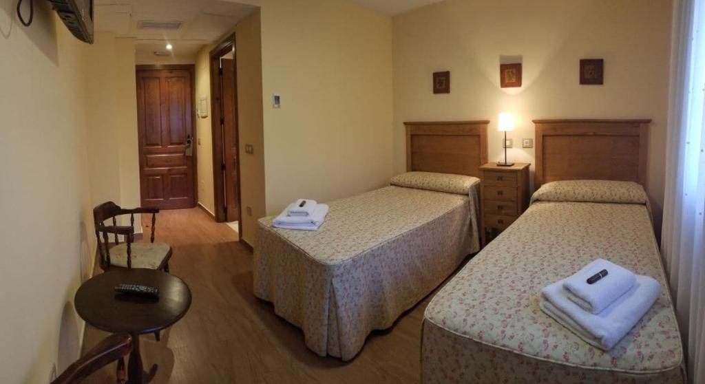 Postel nebo postele na pokoji v ubytování posada trastamara