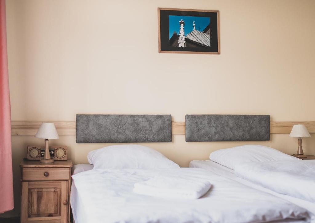 Postel nebo postele na pokoji v ubytování Cybulskiego Guest Rooms