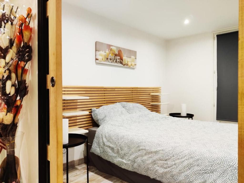 a bedroom with a bed and a desk at SW House Paris Stade de France CDG in Le Blanc-Mesnil