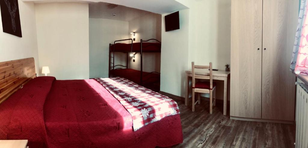 Postel nebo postele na pokoji v ubytování Hotel Piccolo Chalet