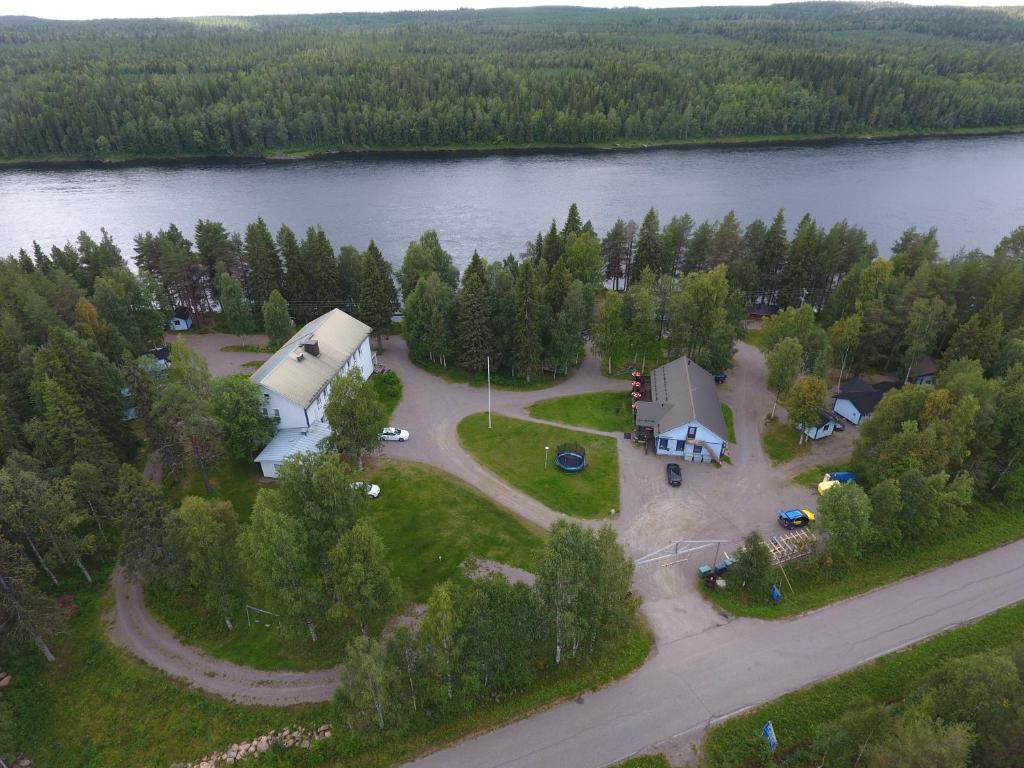 an aerial view of a house on a island in a lake at LappeanLohi in Lappea