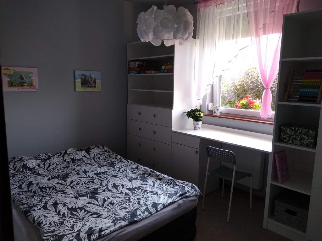 Posteľ alebo postele v izbe v ubytovaní Willa Haneczka