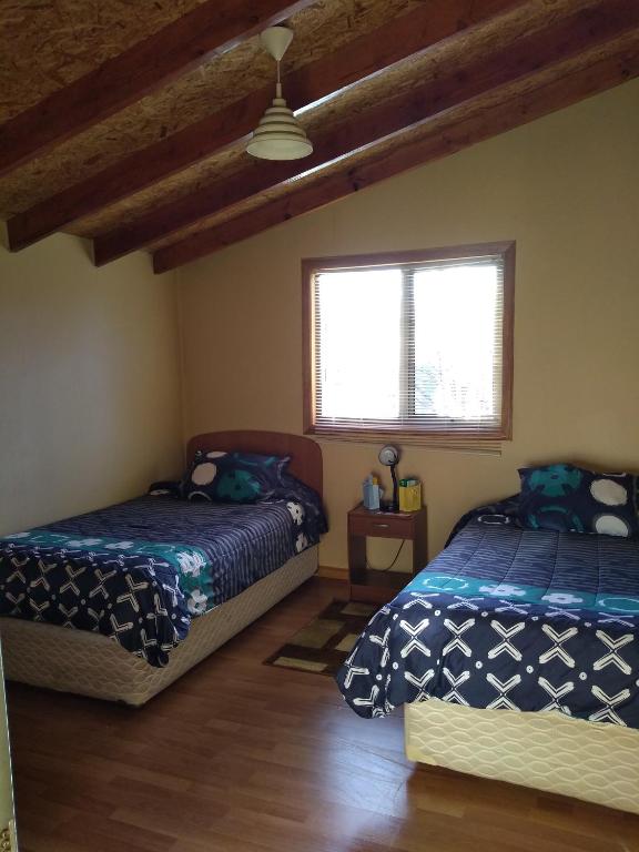 Postelja oz. postelje v sobi nastanitve Hospedaje Martita Patagonia