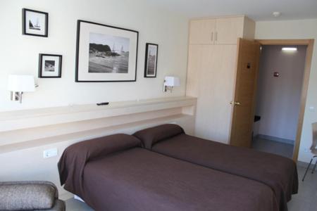 Postel nebo postele na pokoji v ubytování Hostal Solimar