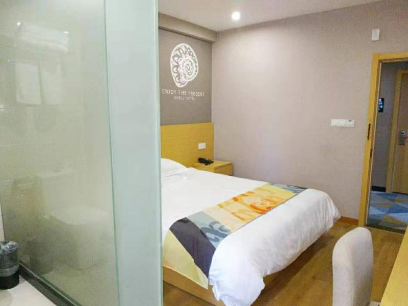 Postel nebo postele na pokoji v ubytování Shell Ningbo Yuyao Xinjian Road Hotel