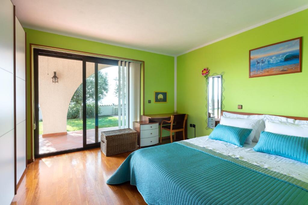 Postel nebo postele na pokoji v ubytování Villa EMI