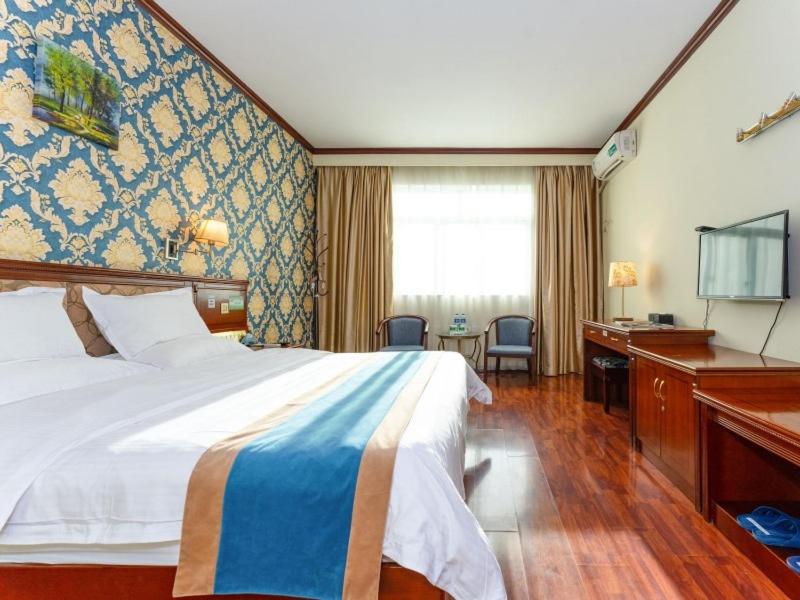 Postel nebo postele na pokoji v ubytování GreenTree Inn Nanning Xiuxiang Branch