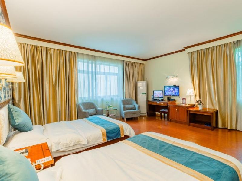 Postel nebo postele na pokoji v ubytování GreenTree Inn Nanning Xiuxiang Branch