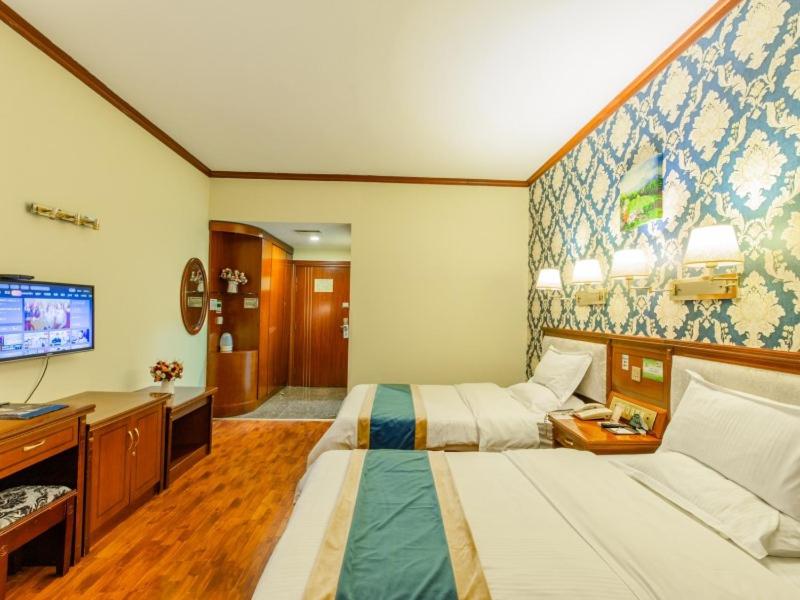 Postel nebo postele na pokoji v ubytování GreenTree Inn Nanning Xiuxiang Branch