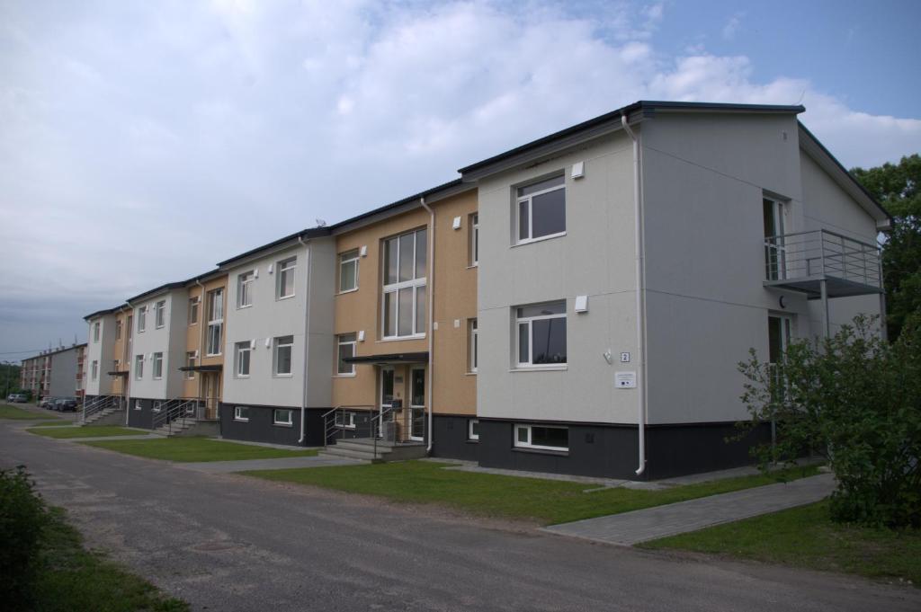 a row of apartment buildings on a street at Hiiumaa Ametikooli Accommodation in Suuremõisa