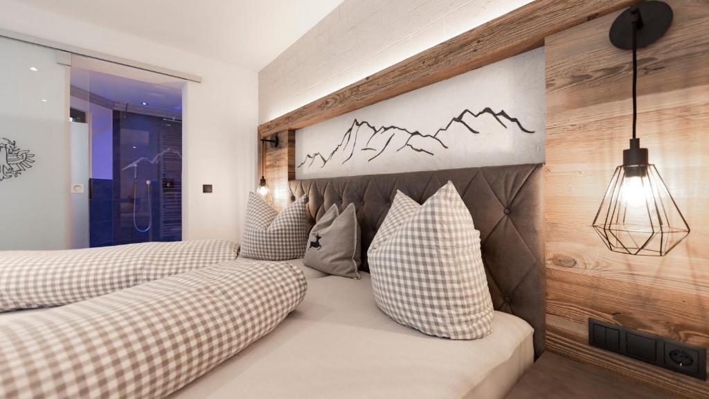 Postel nebo postele na pokoji v ubytování Hotel Tanzer