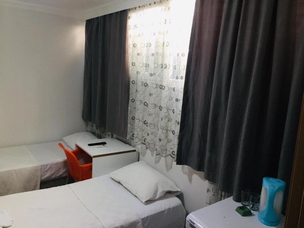 Postel nebo postele na pokoji v ubytování Şato Apart Hotel
