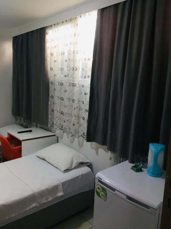 Postel nebo postele na pokoji v ubytování Şato Apart Hotel