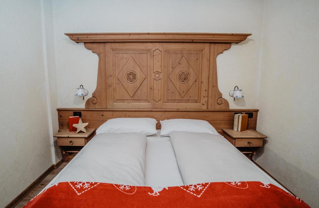 Łóżko lub łóżka w pokoju w obiekcie Pradella Apartments